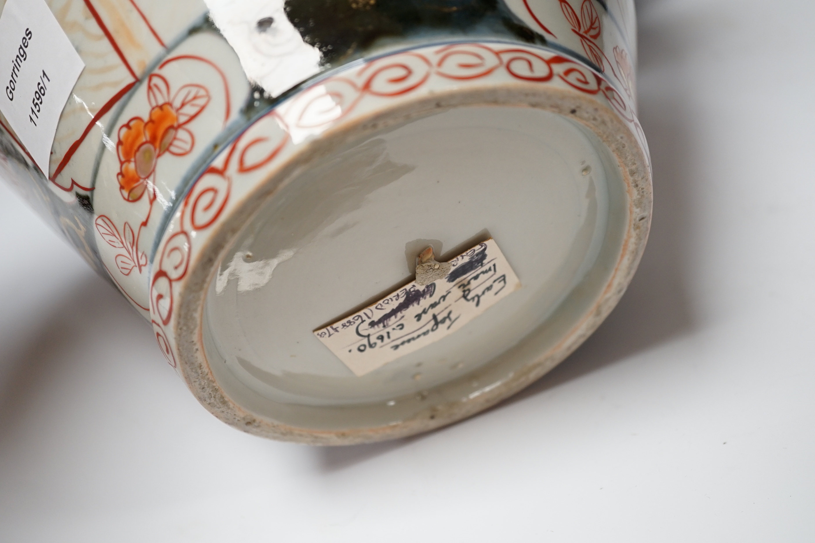 A Japanese Arita Imari pattern vase, c.1690, restored, with an unmatched wooden stand, vase 31cm high